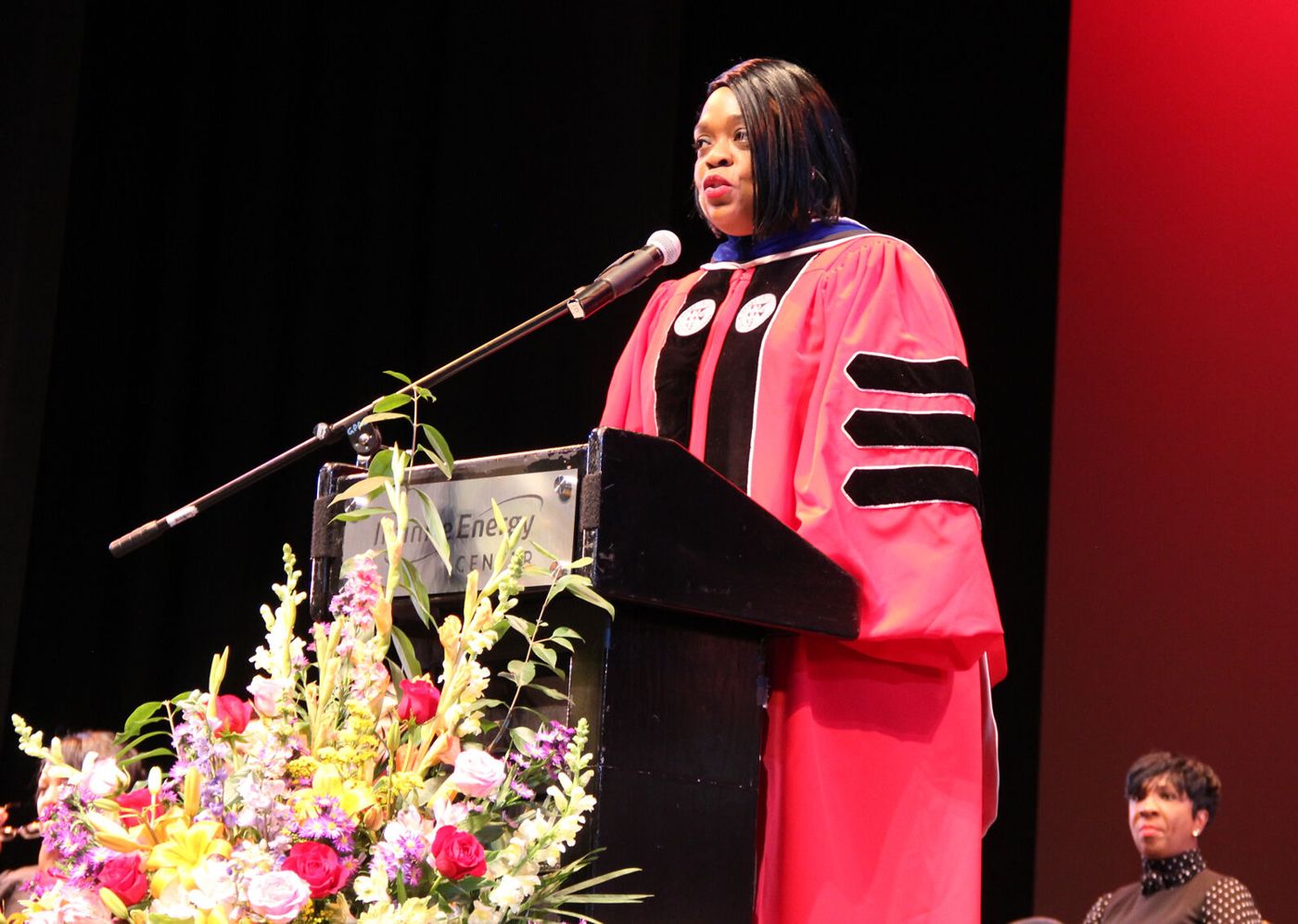 Dr. Sheila at the podium